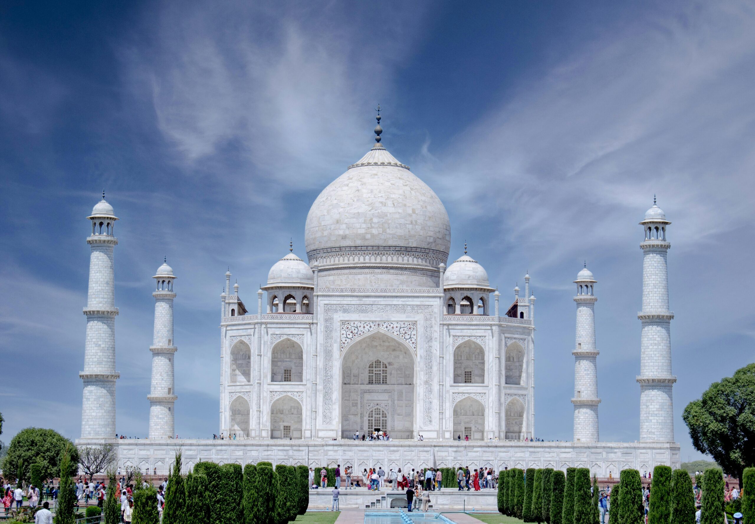 Breathtaking view of the iconic Taj Mahal against a clear blue sky in Agra, India.