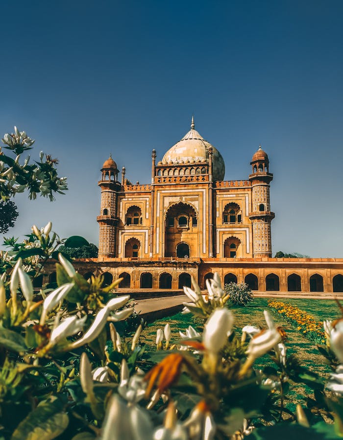 pexels-photo-1007427 Majestic view of Safdarjung Tomb surrounded by gardens in New Delhi, India, under clear skies.