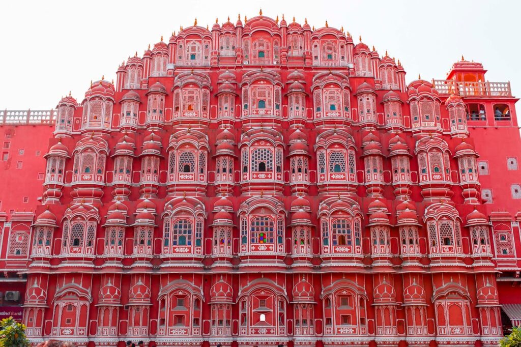 Jaipur One Day Tour Explore the intricate facade of Hawa Mahal in Jaipur, showcasing its stunning pink architecture and cultural significance.